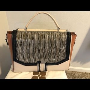 BCBG shoulder hand bag!  Only used 4 times!  Unique color and design.